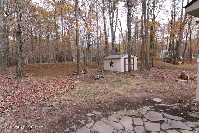 a backyard of a house with lots of green space