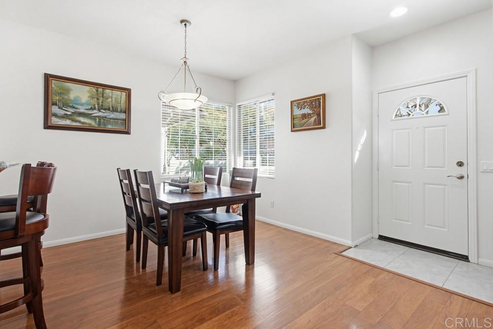 4002 Craven Road, Unit 4 Oceanside, CA 92057 - Photo 12 of 37 a view of a dining room with furniture window and wooden floor