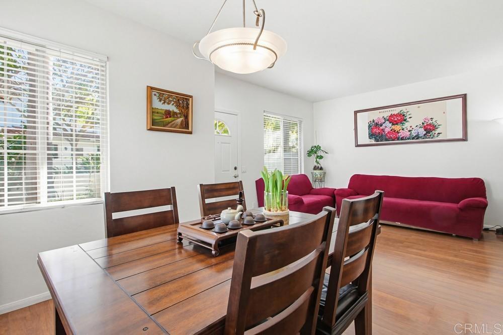 4002 Craven Road, Unit 4 Oceanside, CA 92057 - Photo 13 of 37 a view of a dining room with furniture window and wooden floor