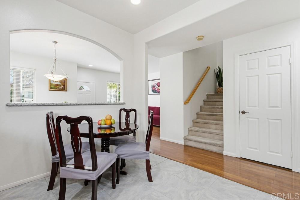 4002 Craven Road, Unit 4 Oceanside, CA 92057 - Photo 17 of 37 a view of a dining room with furniture and wooden floor