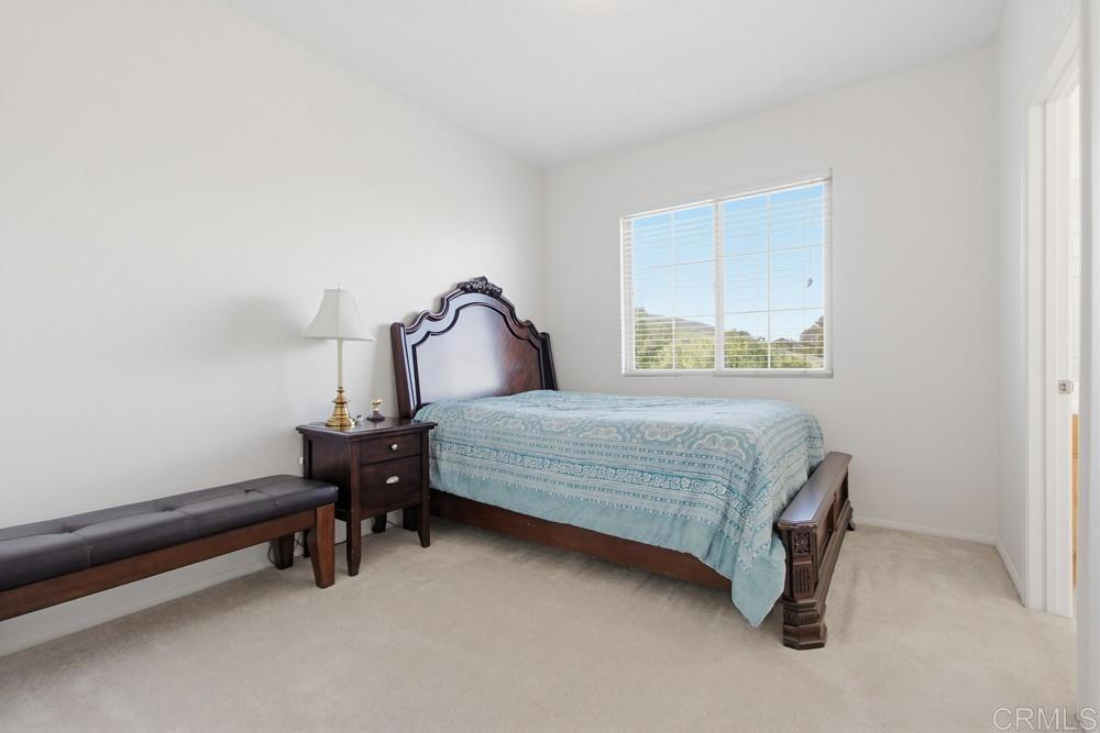 4002 Craven Road, Unit 4 Oceanside, CA 92057 - Photo 22 of 37 a bedroom with a bed and a window
