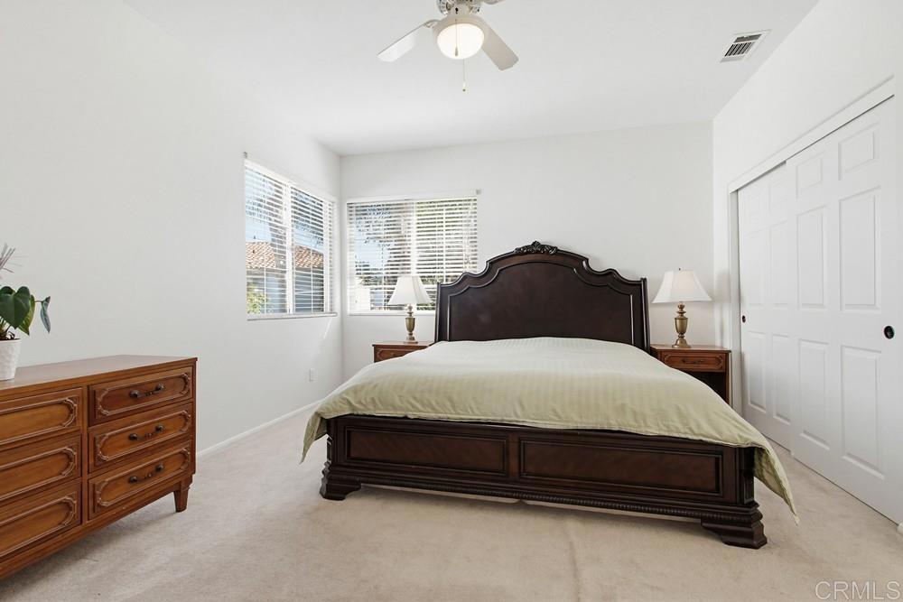 4002 Craven Road, Unit 4 Oceanside, CA 92057 - Photo 27 of 37 a bedroom with a bed and a dresser