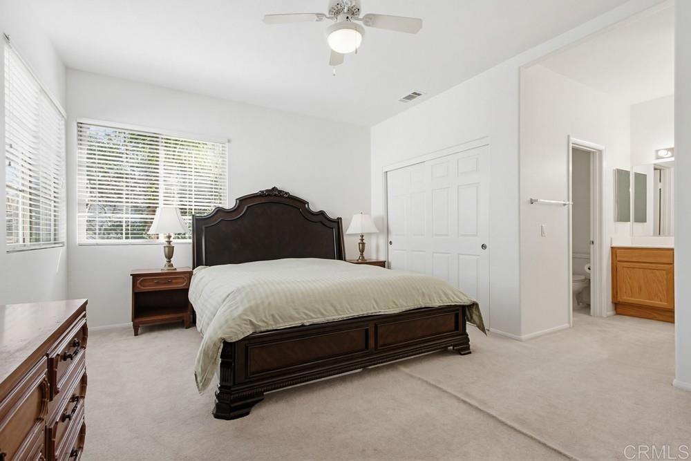 4002 Craven Road, Unit 4 Oceanside, CA 92057 - Photo 28 of 37 a bedroom with a bed and a cabinets