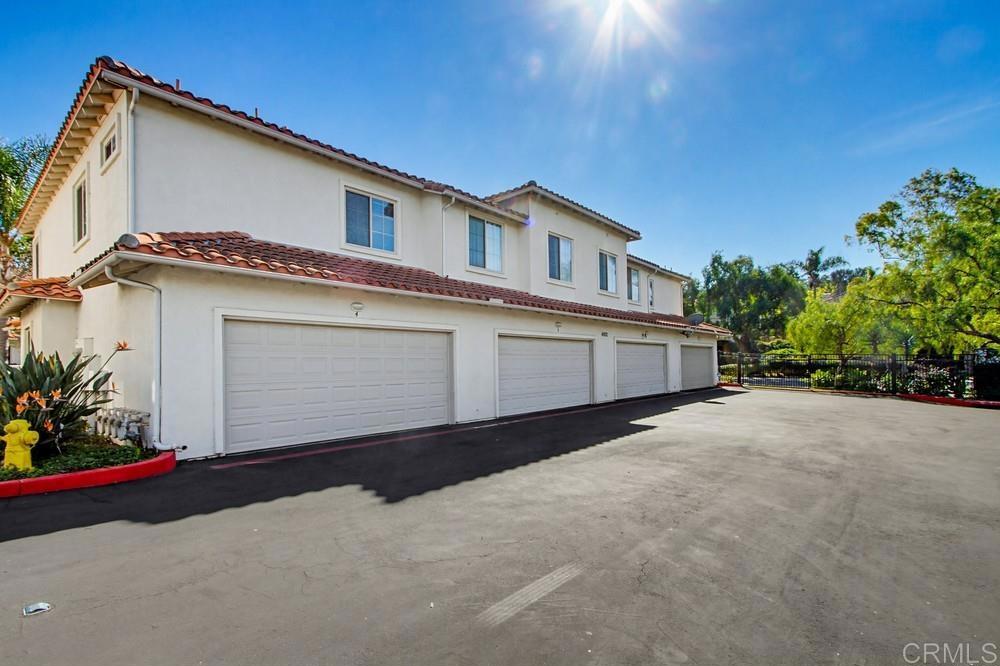 4002 Craven Road, Unit 4 Oceanside, CA 92057 - Photo 34 of 37 a front view of a house with a yard and garage