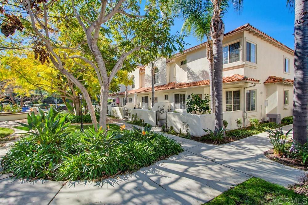 4002 Craven Road, Unit 4 Oceanside, CA 92057 - Photo 35 of 37 a view of a white house next to a yard with potted plants