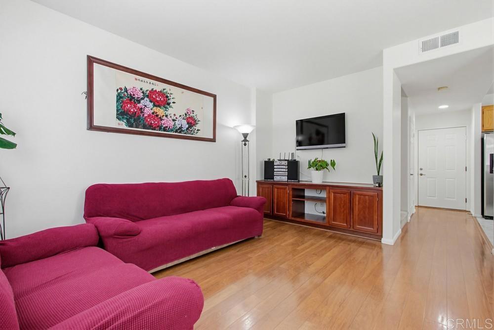 4002 Craven Road, Unit 4 Oceanside, CA 92057 - Photo 8 of 37 a living room with furniture and a flat screen tv