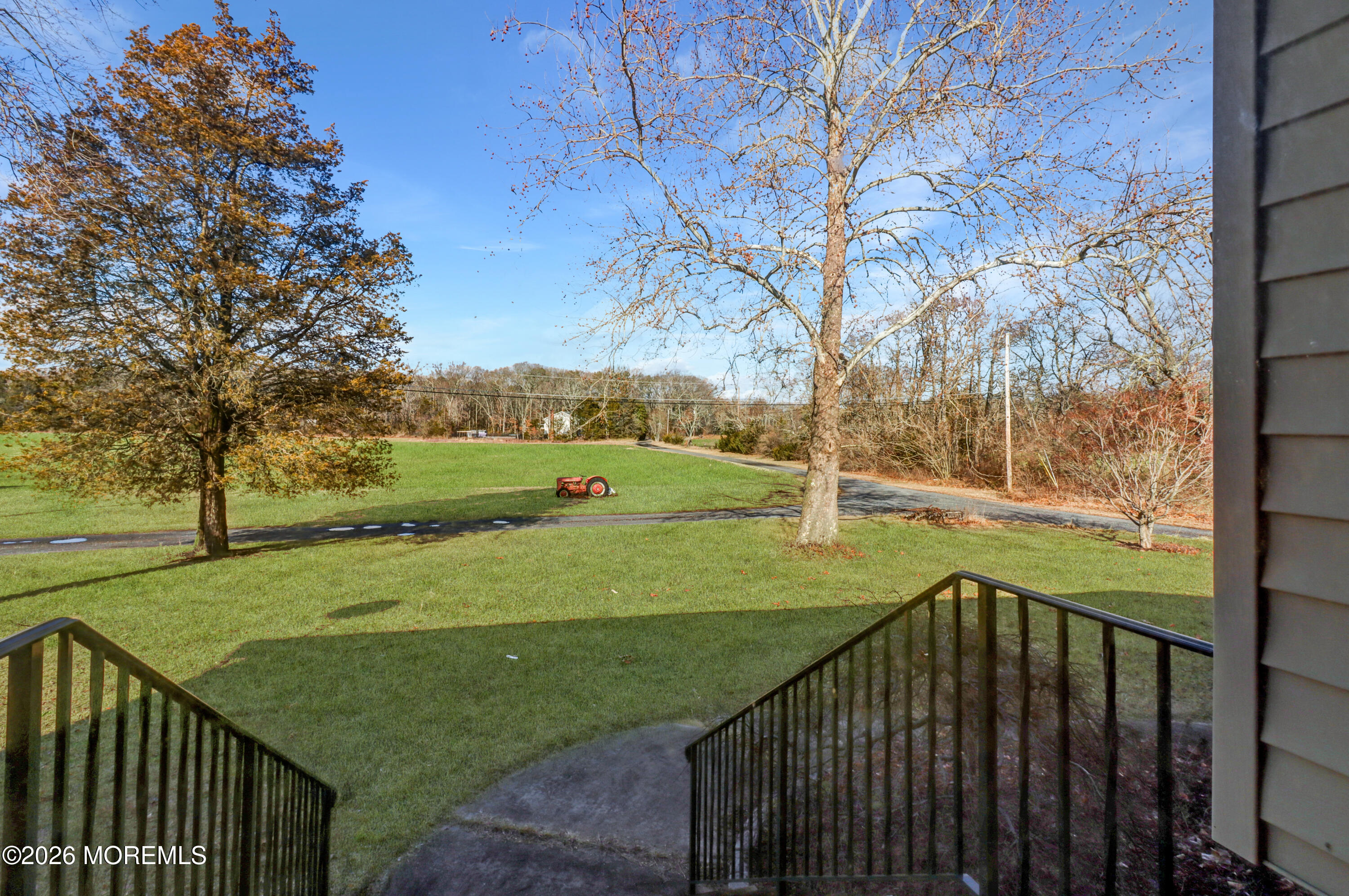 170-174 West Millstream Road Cream Ridge, NJ 08514 - Photo 14 of 105 a view of a deck with a big yard and large trees