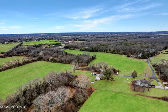 a view of a lake with houses in the back
