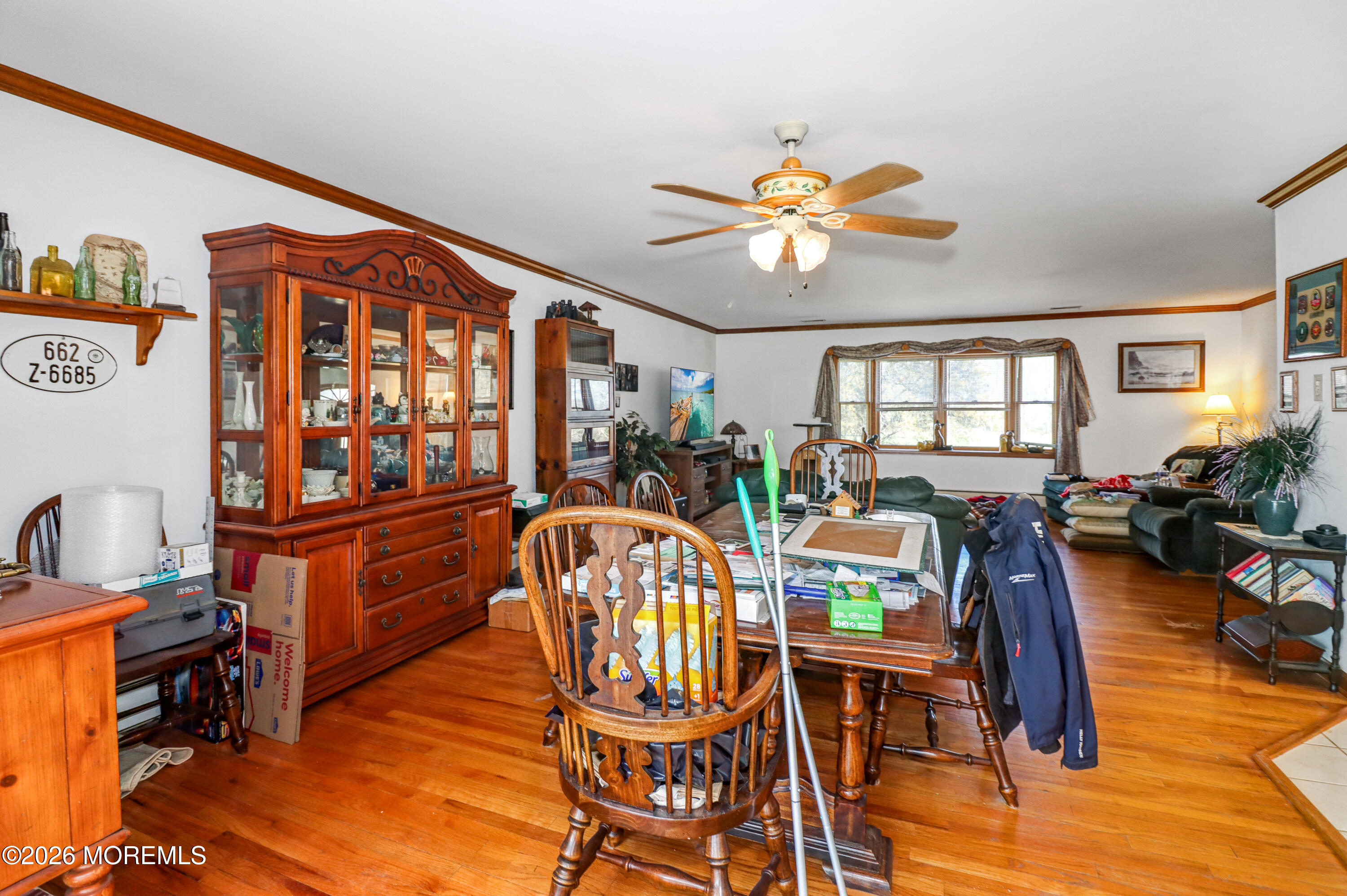 170-174 West Millstream Road Cream Ridge, NJ 08514 - Photo 18 of 105 a view of a dining room with furniture a chandelier and wooden floor