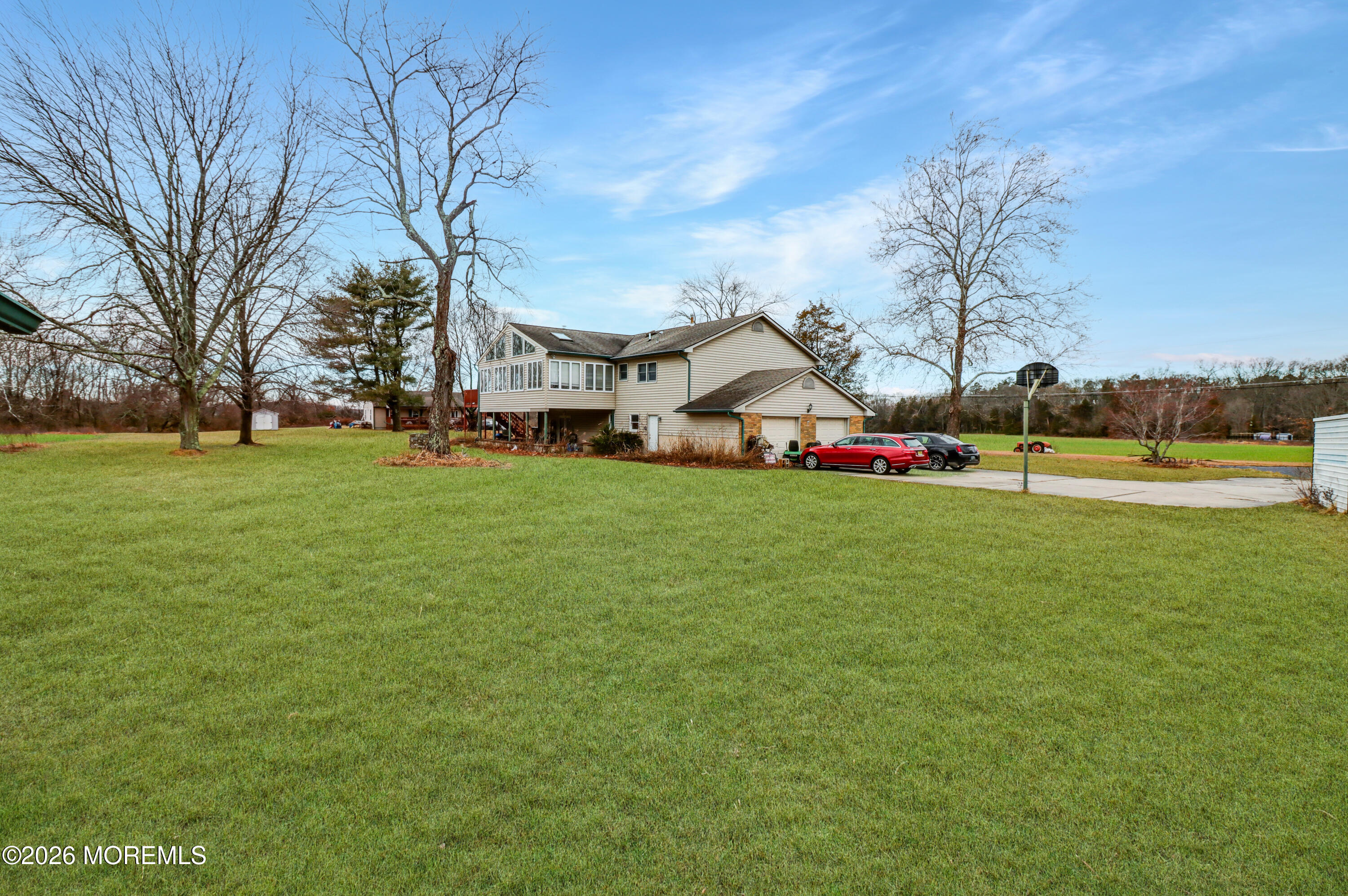 170-174 West Millstream Road Cream Ridge, NJ 08514 - Photo 20 of 105 a view of a house with a big yard and sitting area