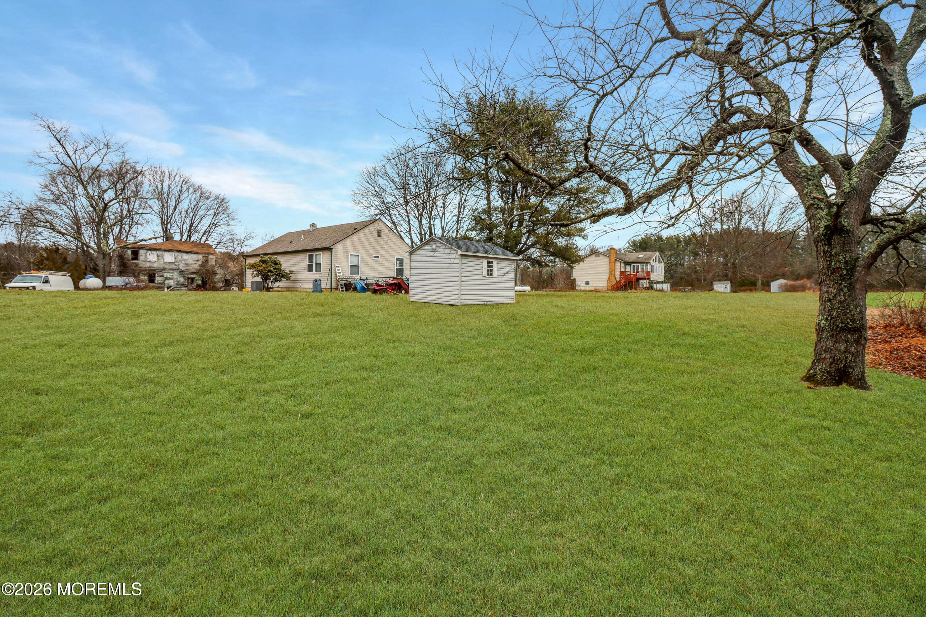 170-174 West Millstream Road Cream Ridge, NJ 08514 - Photo 22 of 105 a front view of house with yard and trees