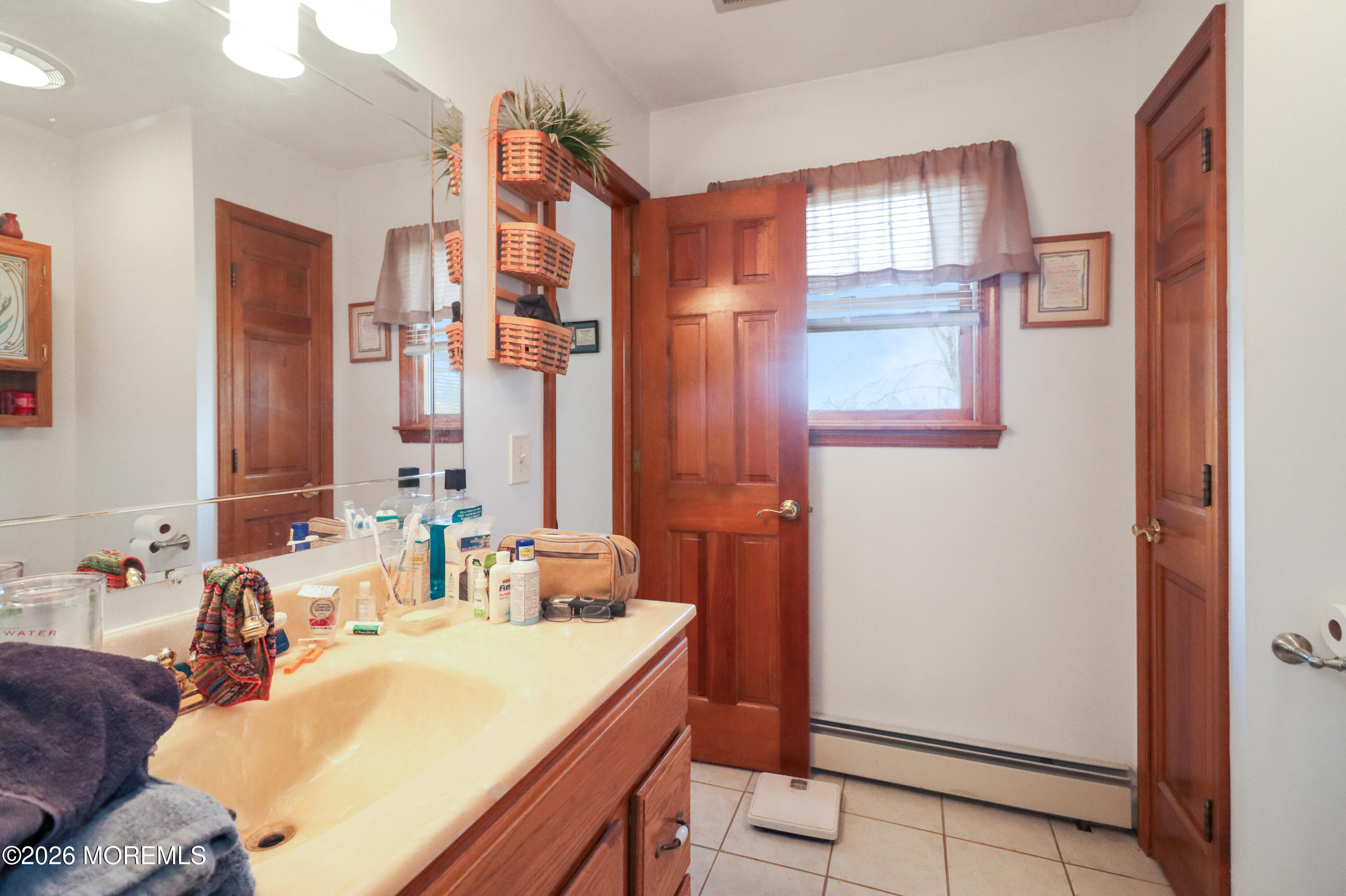 170-174 West Millstream Road Cream Ridge, NJ 08514 - Photo 37 of 105 a bathroom with a sink mirror and a bath tub