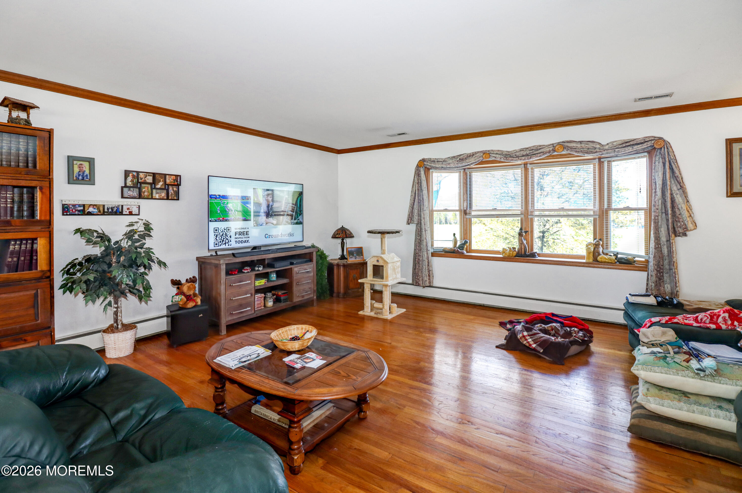 170-174 West Millstream Road Cream Ridge, NJ 08514 - Photo 72 of 105 a living room with furniture and a flat screen tv