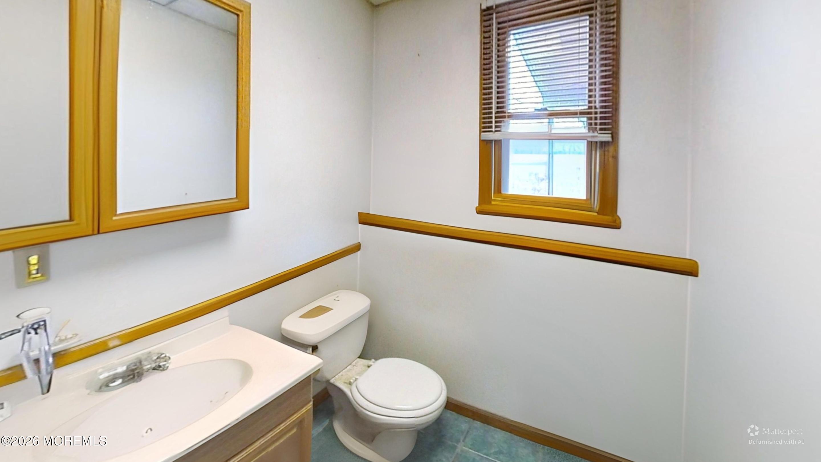 170-174 West Millstream Road Cream Ridge, NJ 08514 - Photo 78 of 105 a bathroom with a sink a toilet and a window