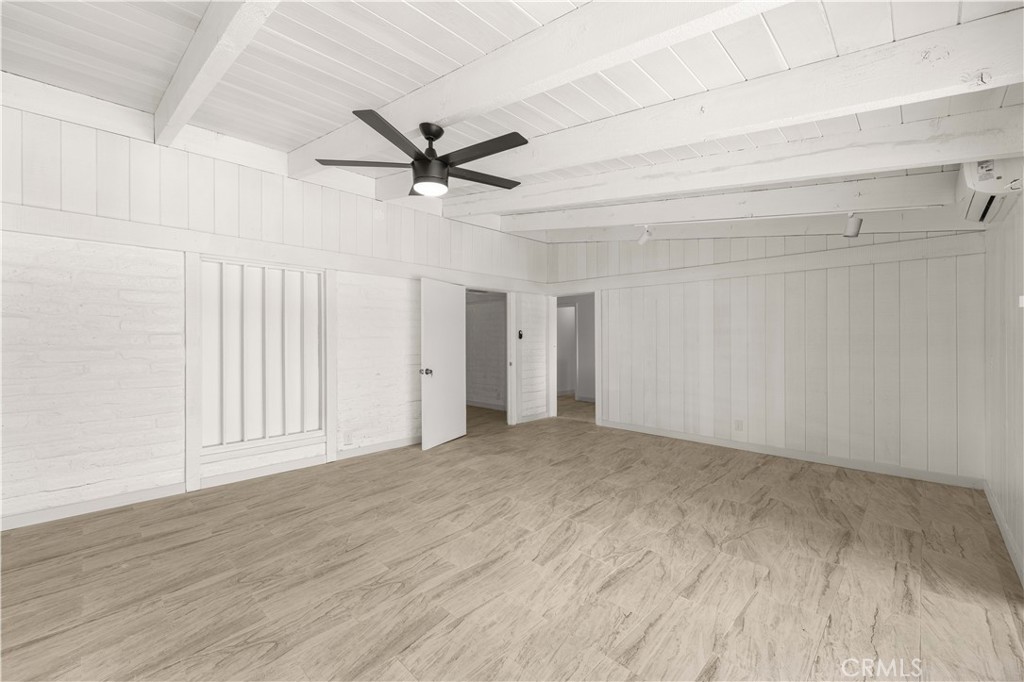 6308 Hawarden Drive Riverside, CA 92506 - Photo 17 of 37 a view of empty room with wooden floor and ceiling fan