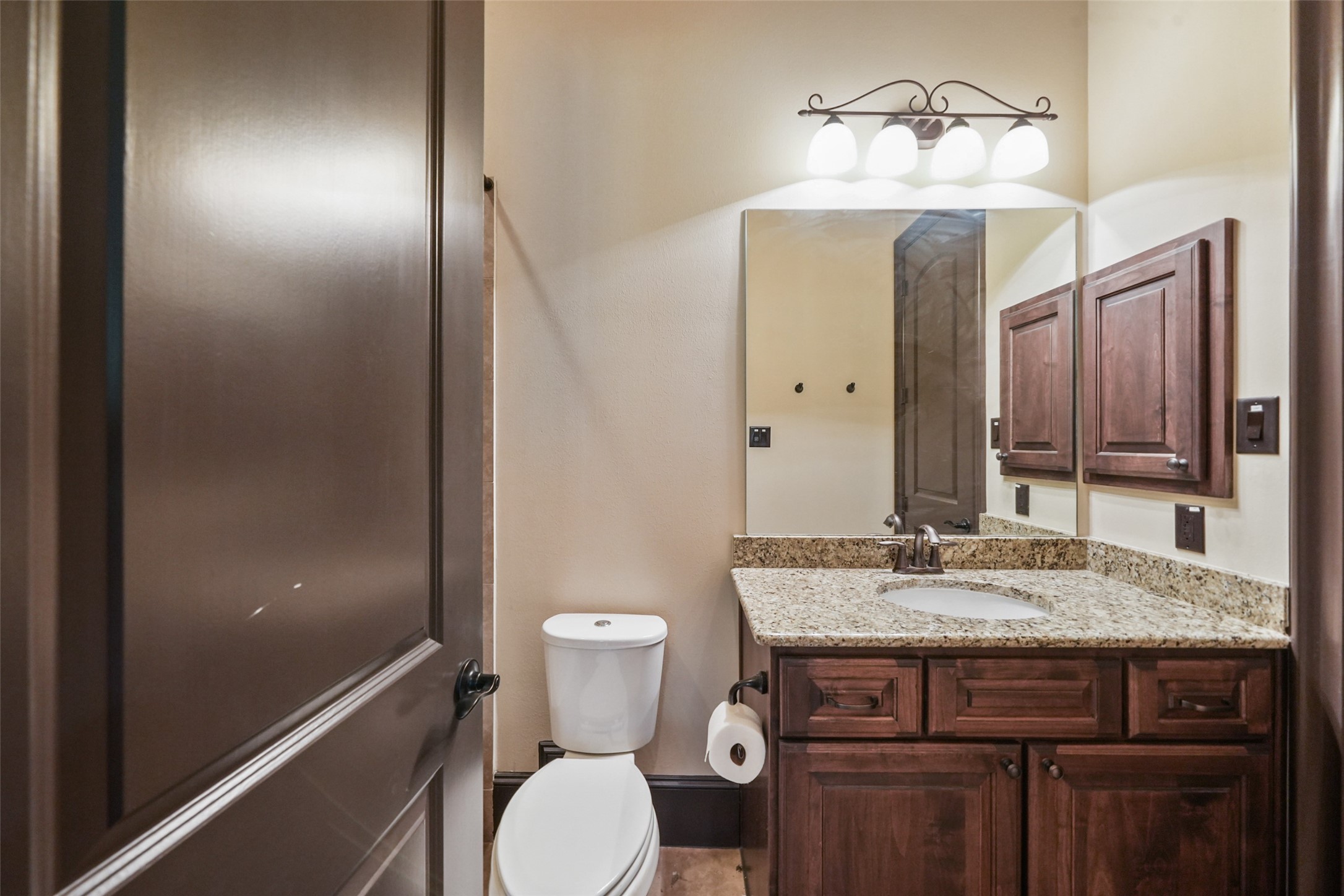 26250 A Riley Road Waller, TX 77484 - Photo 14 of 50 Full bath with granite vanity, framed mirror, and tiled tub/shower—clean, functional, and well-finished.