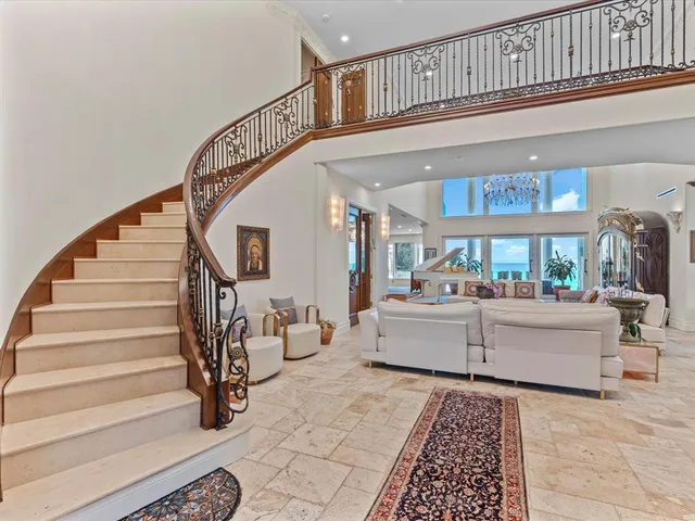 a living room with furniture and stairs