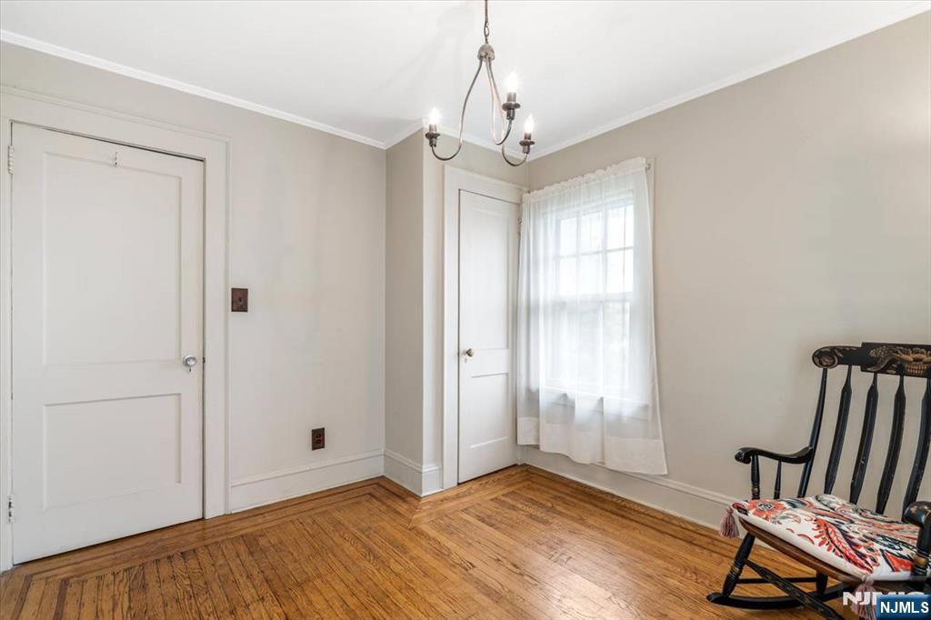 217 Mountain Way Rutherford, NJ 07070 - Photo 19 of 28 a view of an empty room with wooden floor and a window