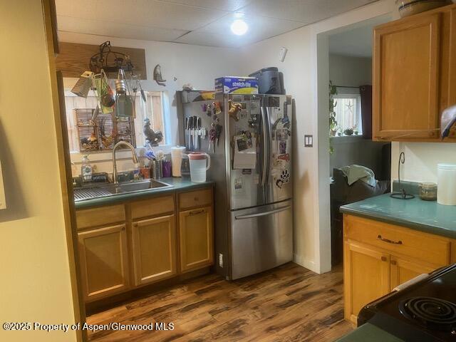 336 East 7th Street Rifle, CO 81650 - Photo 8 of 13 a kitchen with stainless steel appliances granite countertop a refrigerator and a sink
