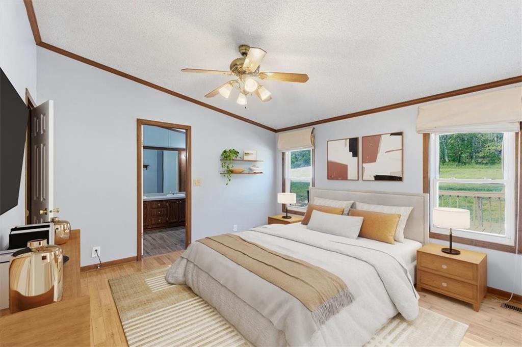 235 Kirk Road Northwest White, GA 30184 - Photo 13 of 41 a bedroom with a bed and a chandelier