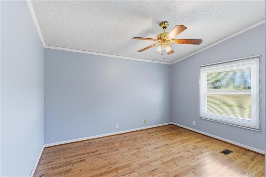 235 Kirk Road Northwest White, GA 30184 - Photo 18 of 41 an empty room with a window and a fan