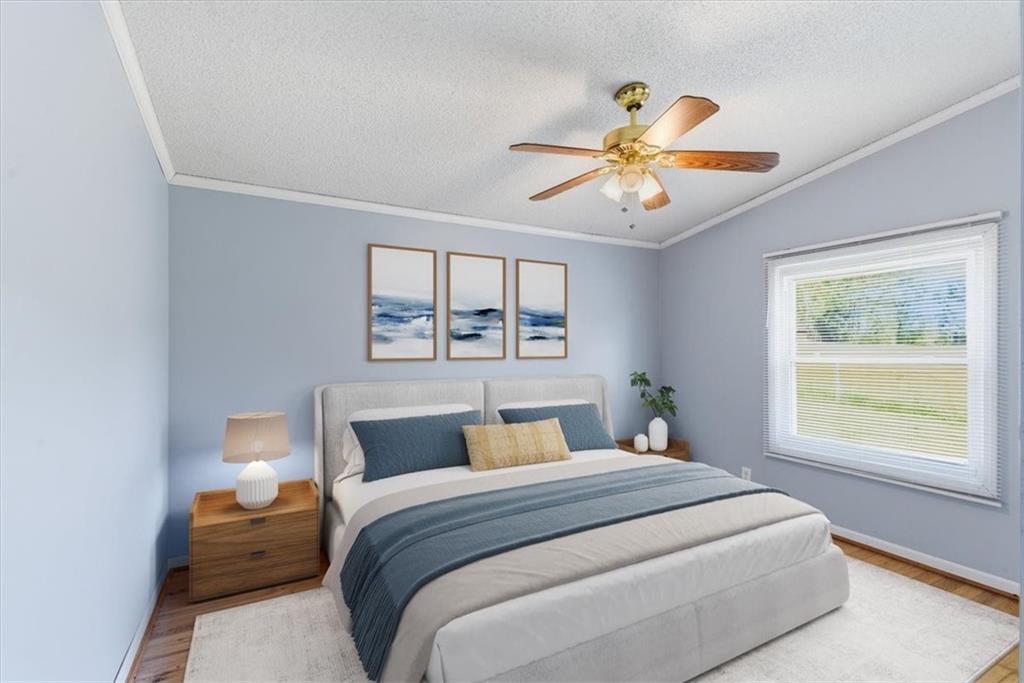 235 Kirk Road Northwest White, GA 30184 - Photo 19 of 41 a bedroom with a bed and a window