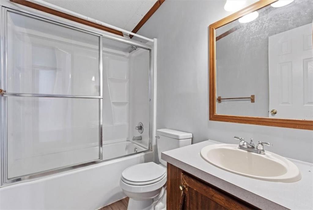 235 Kirk Road Northwest White, GA 30184 - Photo 20 of 41 a bathroom with a sink toilet and shower