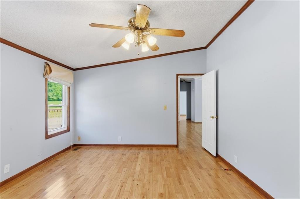 235 Kirk Road Northwest White, GA 30184 - Photo 21 of 41 an empty room with wooden floor and windows