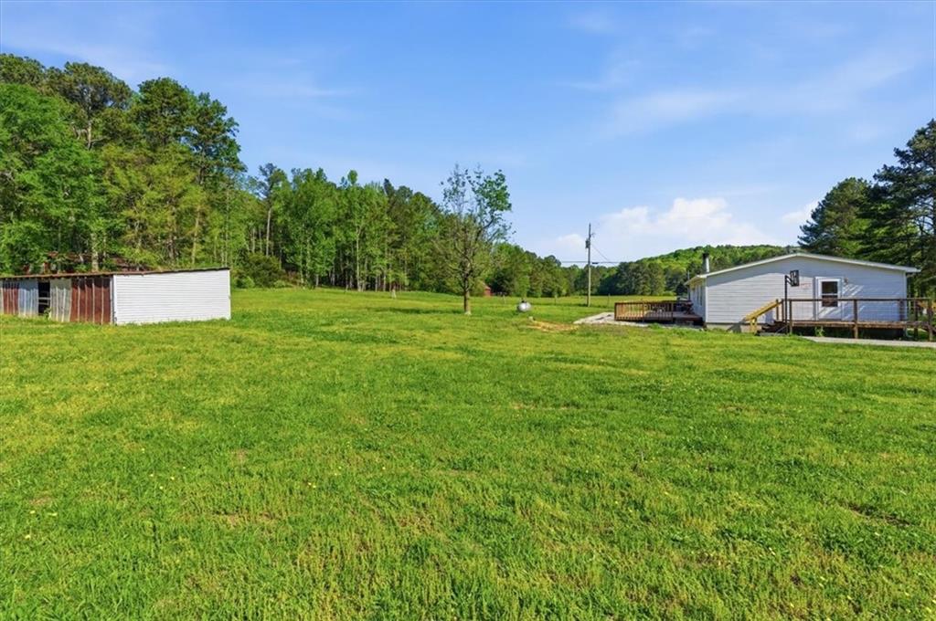 235 Kirk Road Northwest White, GA 30184 - Photo 27 of 41 a house view with a big yard