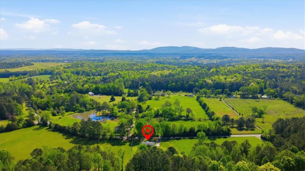 235 Kirk Road Northwest White, GA 30184 - Photo 39 of 41 a view of a lush green hillside and houses