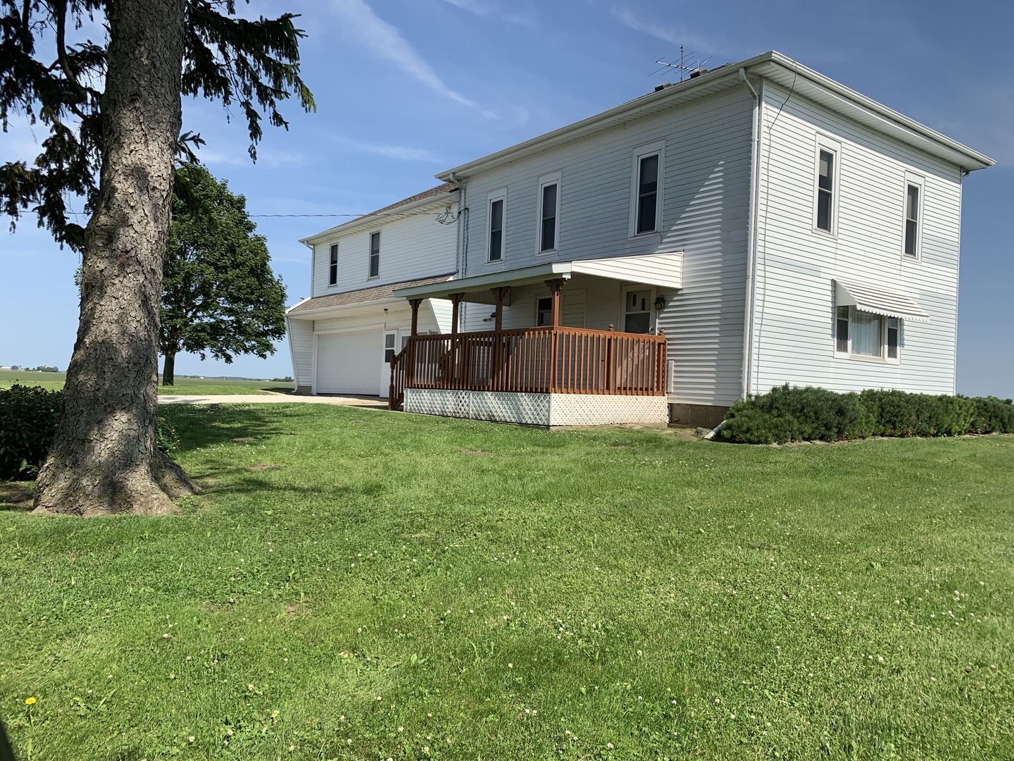 8388 South Brooklyn Road Rochelle, IL 61068 - Photo 2 of 32 a view of a house with a yard and sitting area
