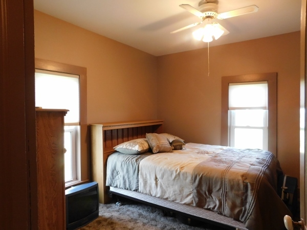 8388 South Brooklyn Road Rochelle, IL 61068 - Photo 18 of 32 a bedroom with a bed and a window