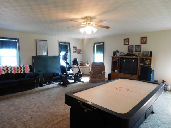 8388 South Brooklyn Road Rochelle, IL 61068 - Photo 22 of 32 a room with a chandelier furniture and a chandelier