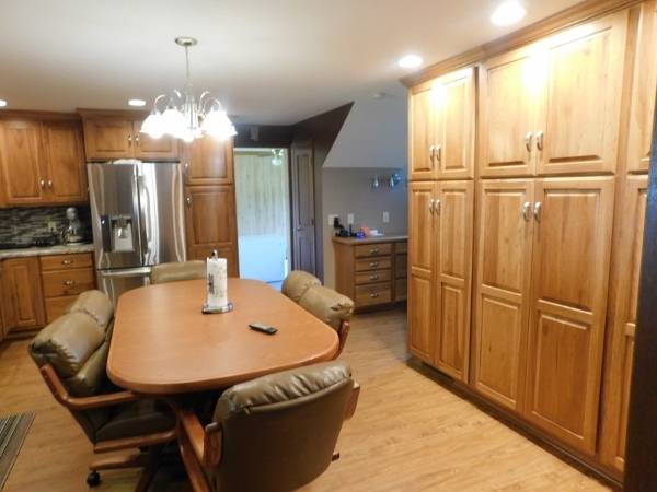 8388 South Brooklyn Road Rochelle, IL 61068 - Photo 7 of 32 a dining table with chairs and chandelier