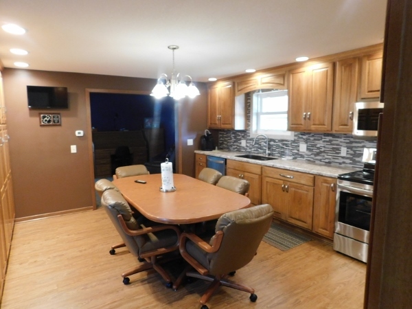 8388 South Brooklyn Road Rochelle, IL 61068 - Photo 10 of 32 a kitchen with a table and chairs in it