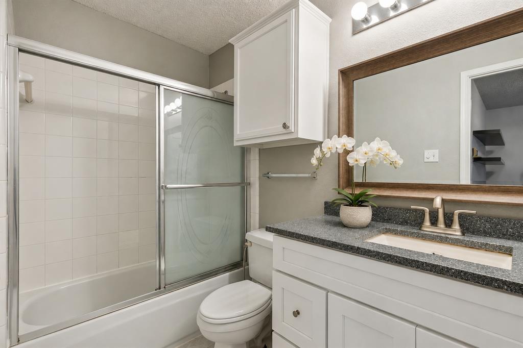 400 Moss Hill Road Irving, TX 75063 - Photo 21 of 26 Generous Secondary Bathroom with Glass Door