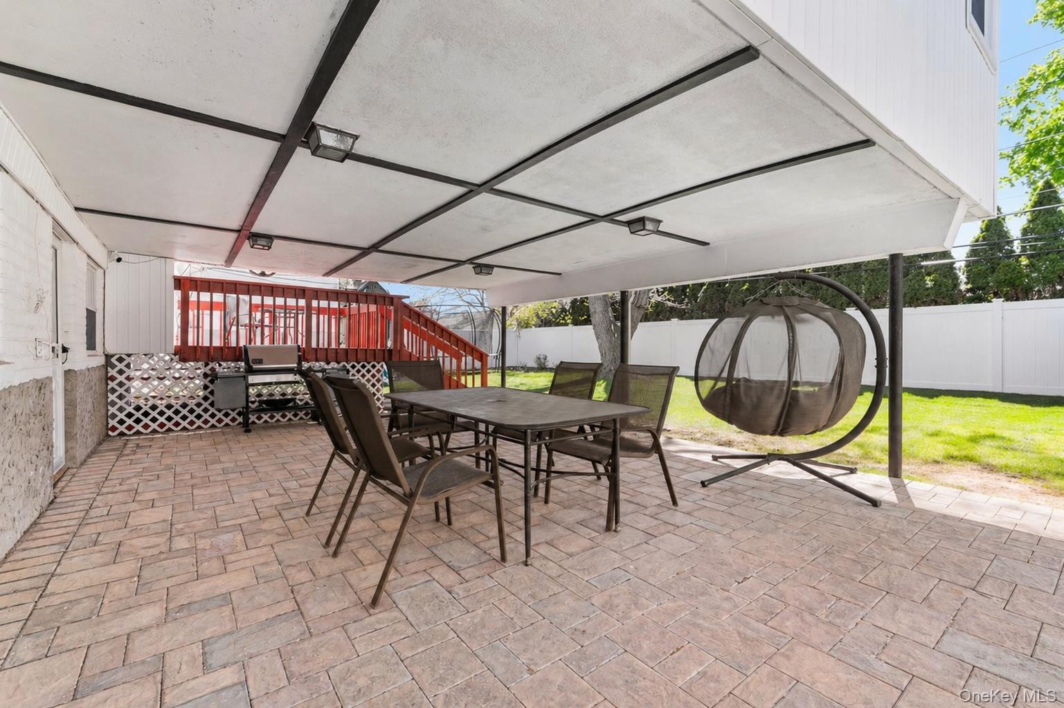61 Winthrop Road Plainview, NY 11803 - Photo 32 of 37 a view of a swimming pool with a patio and a backyard