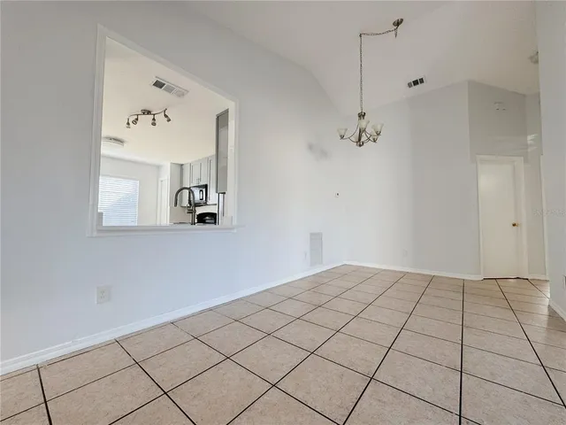 a view of a room with a book shelf
