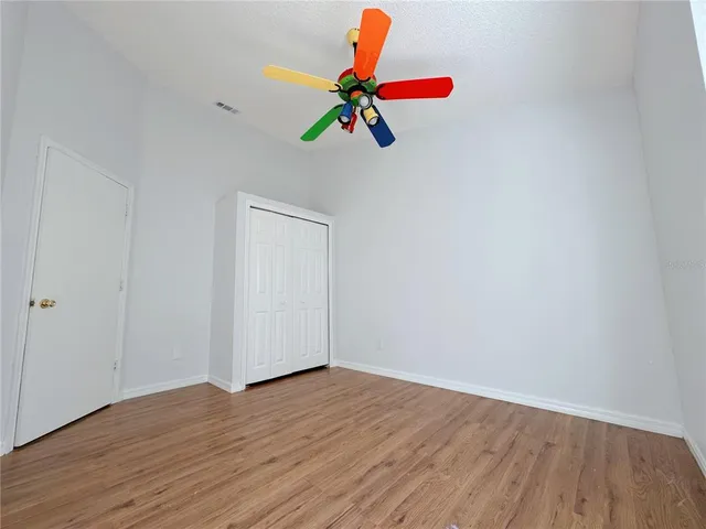 a view of an entryway with wooden floor