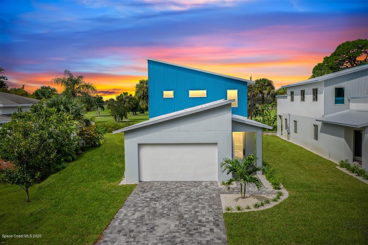 2158 Country Club Road Melbourne, FL 32901 - Photo 1 of 94 a view of an house with backyard space and garden
