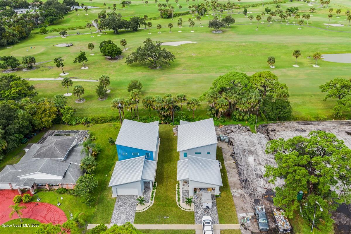 2158 Country Club Road Melbourne, FL 32901 - Photo 3 of 94 an aerial view of residential houses with outdoor space and river