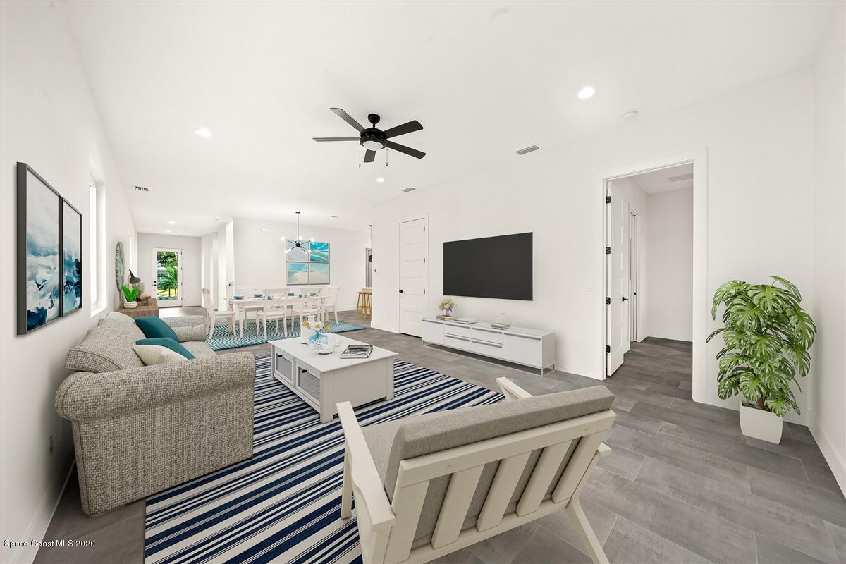 2158 Country Club Road Melbourne, FL 32901 - Photo 21 of 94 a living room with furniture and a flat screen tv