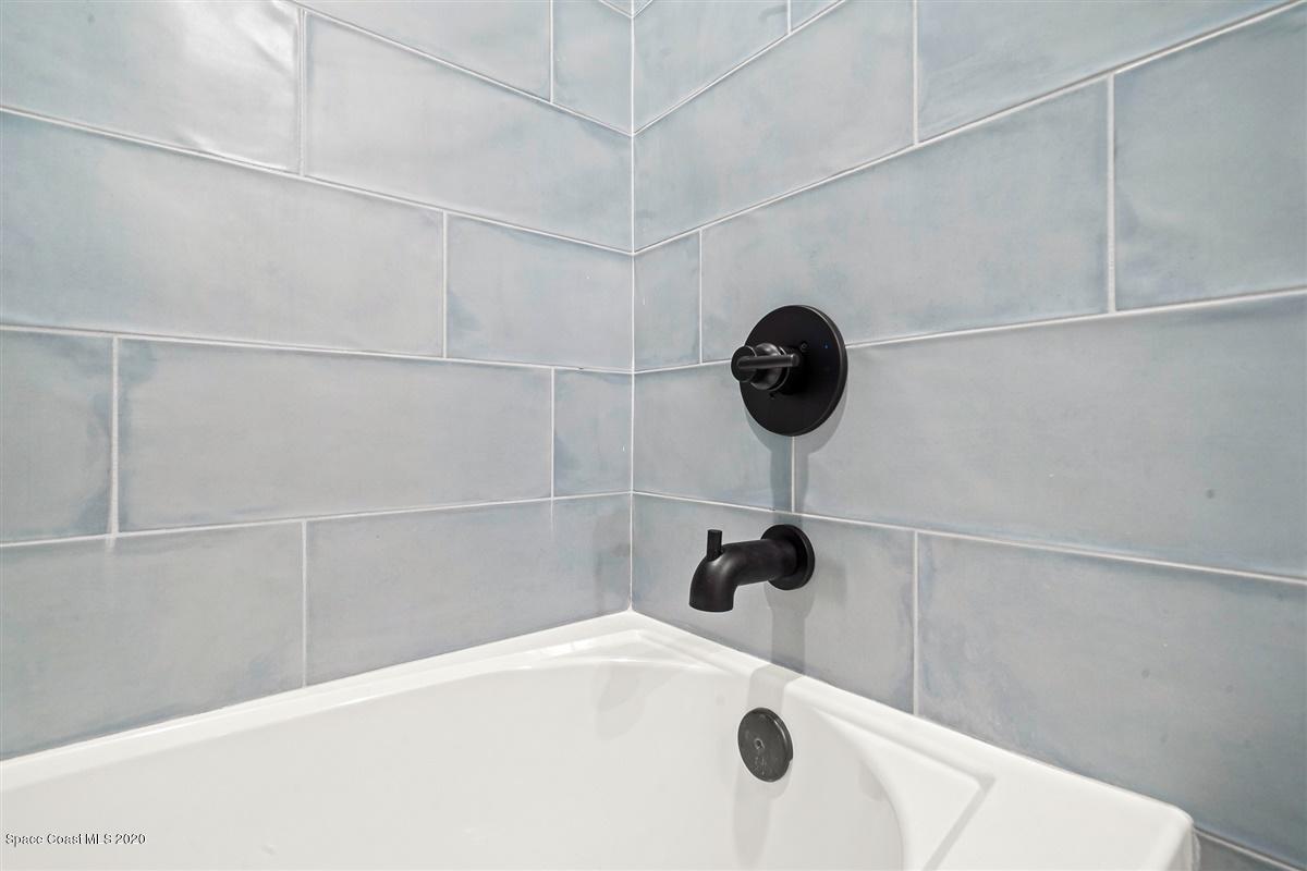 2158 Country Club Road Melbourne, FL 32901 - Photo 52 of 94 a bathroom with a shower