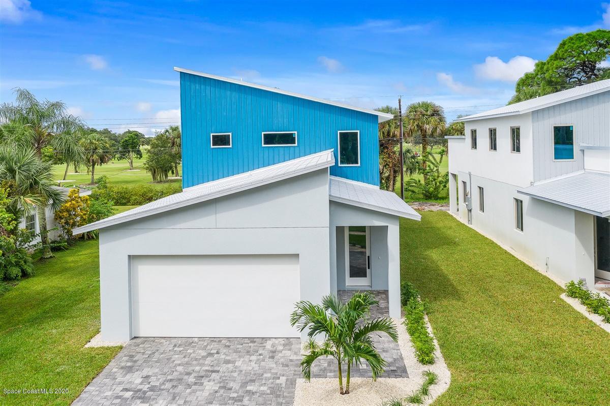 2158 Country Club Road Melbourne, FL 32901 - Photo 93 of 94 a front view of a house with a yard