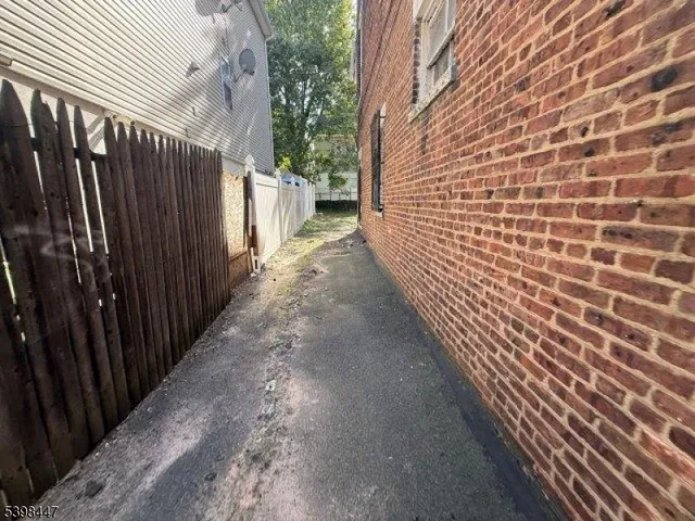 a view of a pathway with a building in the background