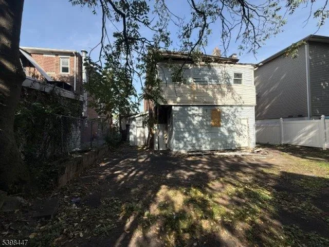 a view of a house with a street