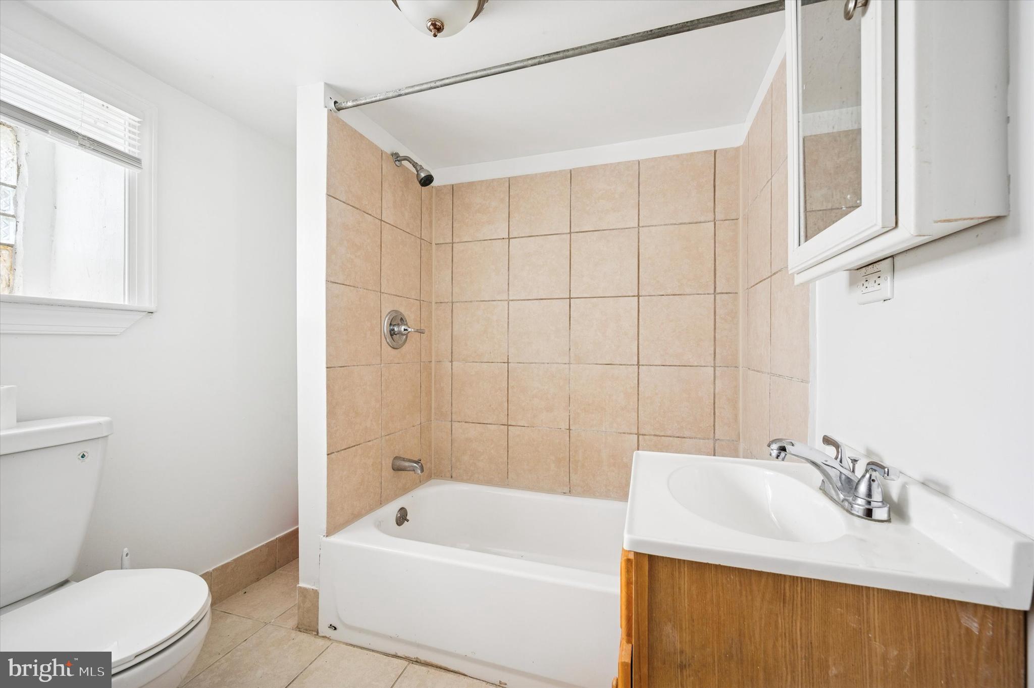 2000 Widener Place, Unit 2 Philadelphia, PA 19138 - Photo 11 of 15 a bathroom with a sink a toilet and shower