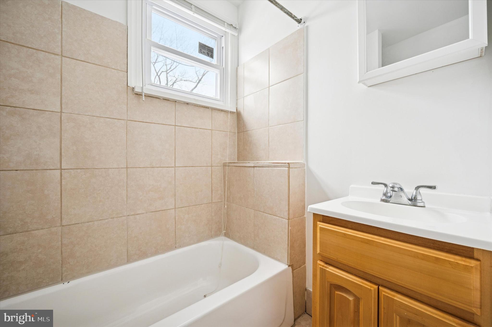 2000 Widener Place, Unit 2 Philadelphia, PA 19138 - Photo 12 of 15 a bathroom with a bathtub and a sink