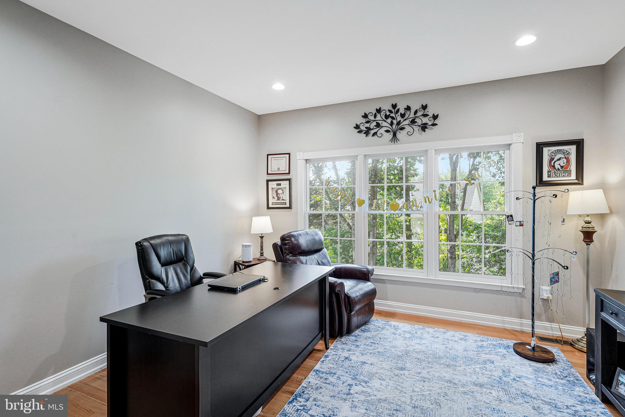 20627 Cutwater Place Sterling, VA 20165 - Photo 19 of 42 a living room with furniture and a floor to ceiling window