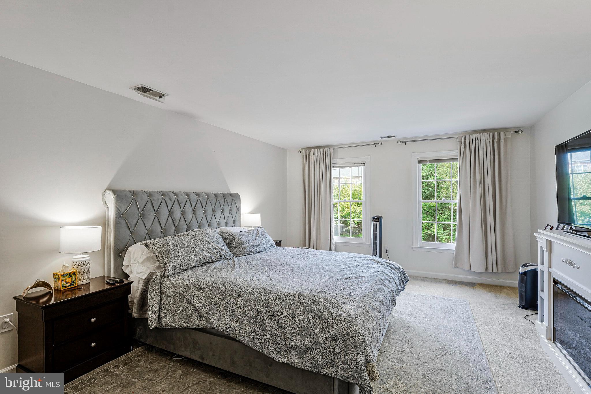 20627 Cutwater Place Sterling, VA 20165 - Photo 21 of 42 a bedroom with a bed and a window